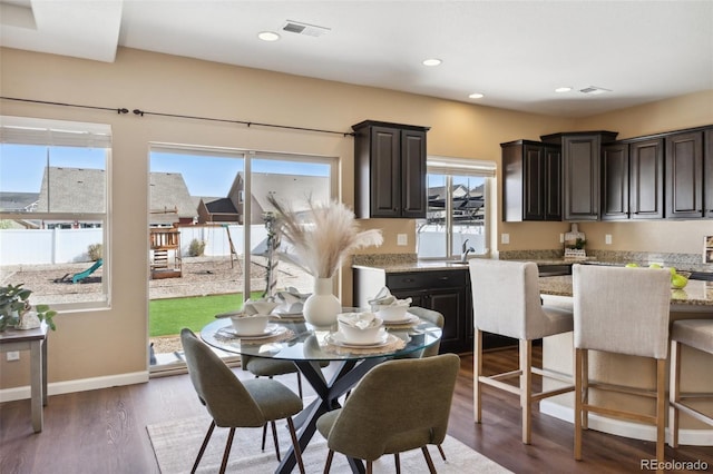 dining area featuring baseboards, visible vents, recessed lighting, and dark wood-type flooring