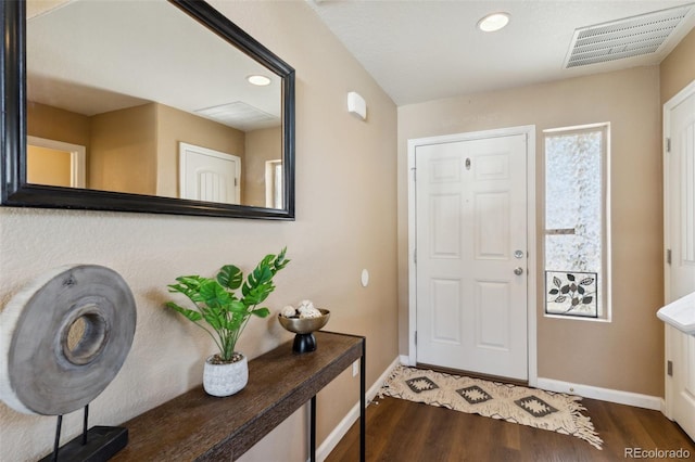 foyer entrance featuring recessed lighting, wood finished floors, visible vents, and baseboards