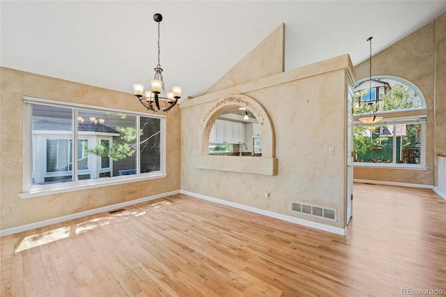 6846 Edgewood Way, Highlands Ranch, CO 80130 - unfurnished room featuring a chandelier, wood finished floors, and high vaulted ceiling