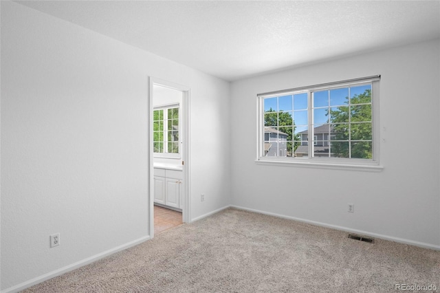 6846 Edgewood Way, Highlands Ranch, CO 80130 - empty room with healthy amount of natural light and light colored carpet