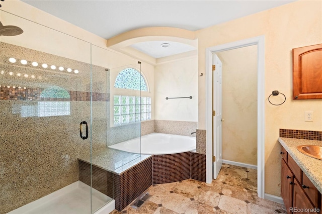 6846 Edgewood Way, Highlands Ranch, CO 80130 - full bathroom with vanity, a garden tub, and a stall shower