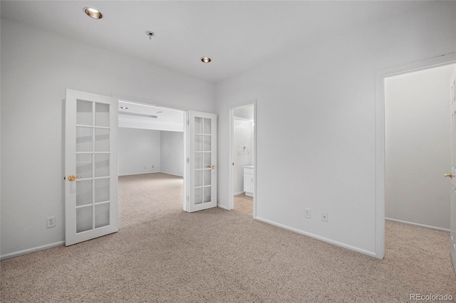 6846 Edgewood Way, Highlands Ranch, CO 80130 - unfurnished bedroom with french doors, carpet floors, a walk in closet, and recessed lighting