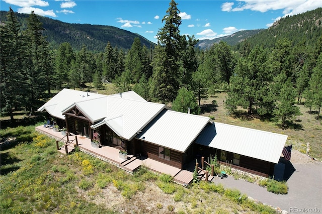 birds eye view of property with a mountain view