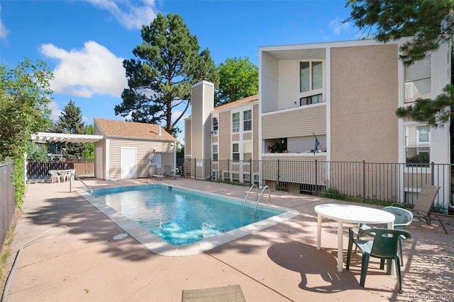 3874 S Fraser St Unit P11, Aurora, CO 80014 - community pool featuring a patio area and an outdoor structure