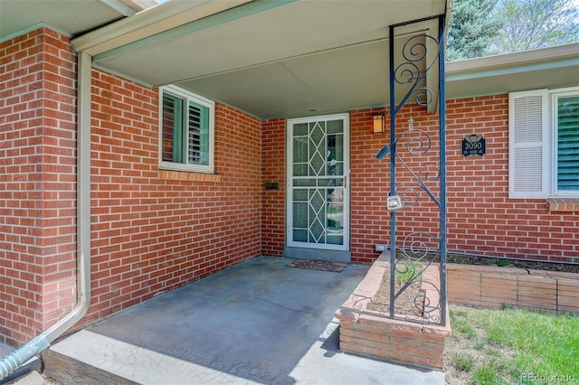3090 S High St, Denver, CO 80210 - entrance to property featuring brick siding and a patio