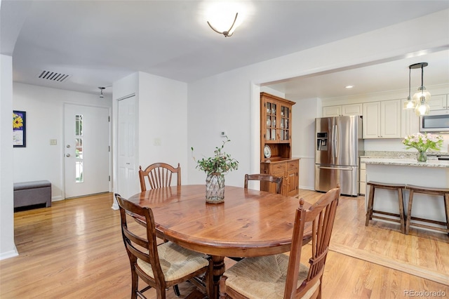 3090 S High St, Denver, CO 80210 - dining area featuring light wood-style flooring, baseboards, and recessed lighting