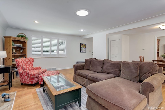 3090 S High St, Denver, CO 80210 - living room featuring light wood-style floors, recessed lighting, and baseboards