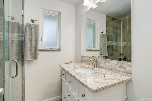 3090 S High St, Denver, CO 80210 - full bath featuring a shower stall, vanity, backsplash, and baseboards