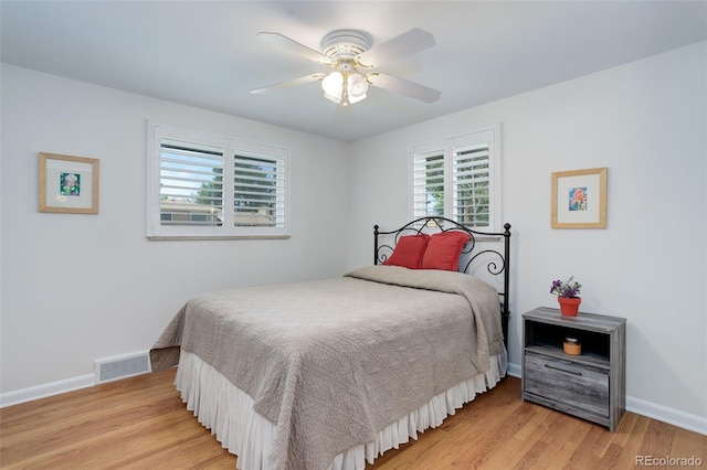 3090 S High St, Denver, CO 80210 - bedroom featuring multiple windows, light wood finished floors, baseboards, and a ceiling fan