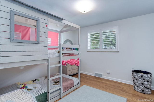 3090 S High St, Denver, CO 80210 - bedroom featuring wood finished floors and baseboards