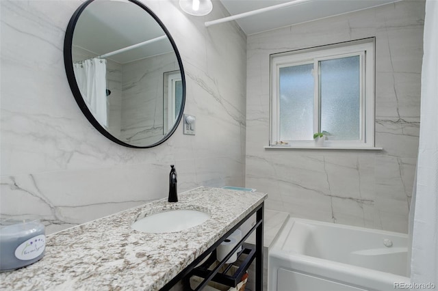 3090 S High St, Denver, CO 80210 - full bathroom featuring tile walls, vanity, and shower / bath combo