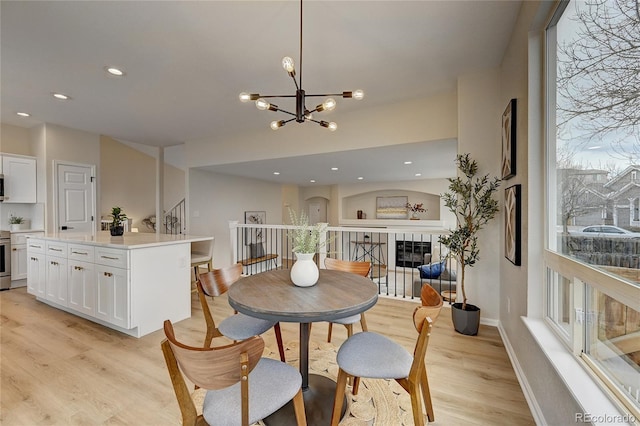 dining room featuring light hardwood / wood-style flooring and a chandelier