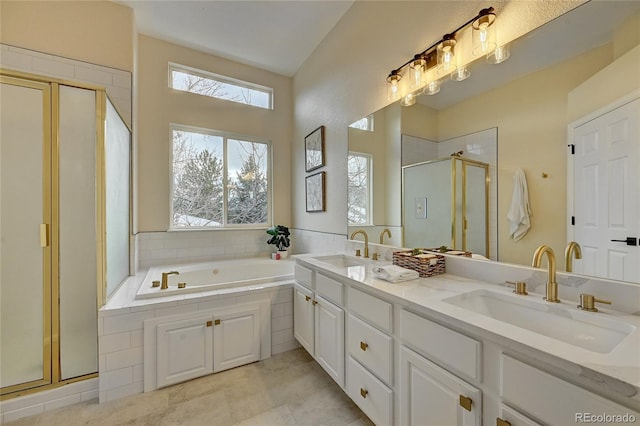 bathroom with plus walk in shower, vanity, and tile patterned floors