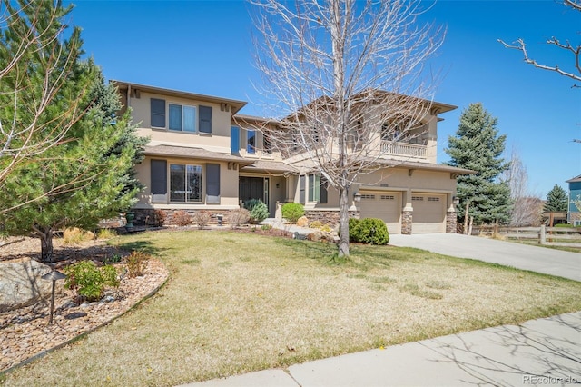 view of front of home featuring a garage and a front lawn