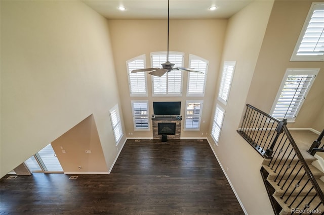 foyer with plenty of natural light, dark hardwood / wood-style flooring, and a high ceiling