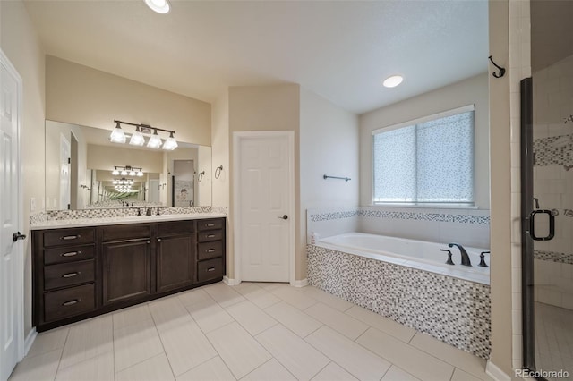 bathroom with vanity, separate shower and tub, and tile flooring