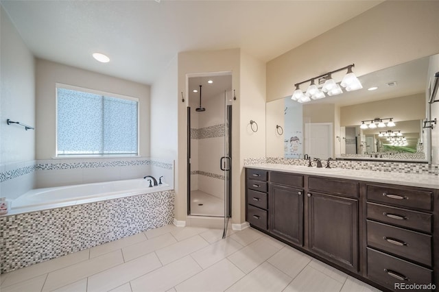 bathroom with vanity, separate shower and tub, and tile flooring