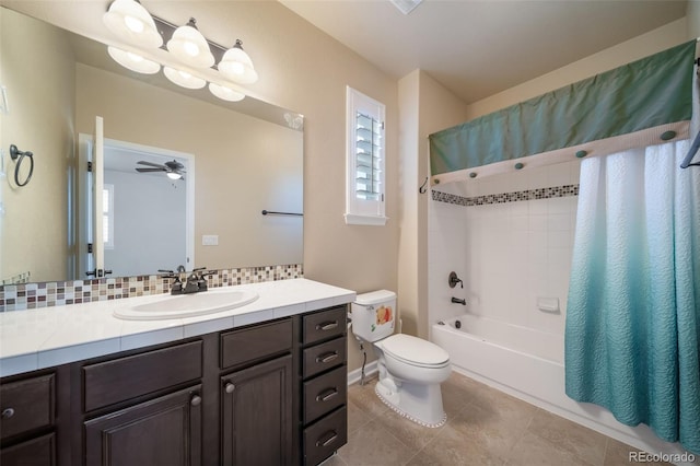 full bathroom with ceiling fan, toilet, tile flooring, shower / bath combo with shower curtain, and vanity