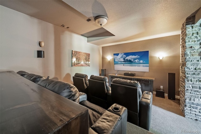 carpeted home theater featuring a textured ceiling