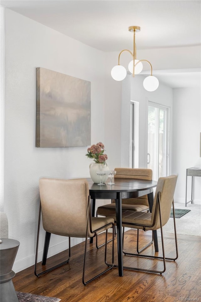 1695 E Eastman Ave, Englewood, CO 80113 - dining room featuring wood finished floors and baseboards