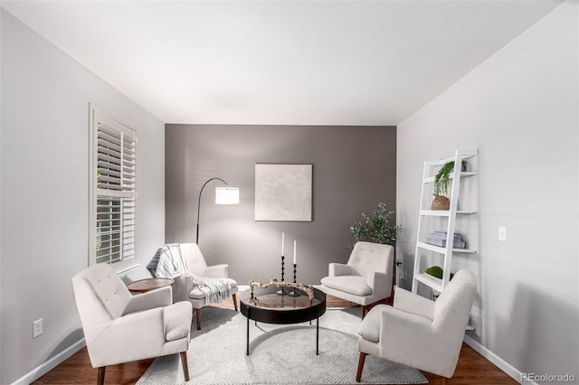 sitting room featuring wood finished floors and baseboards
