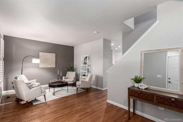 sitting room featuring wood finished floors and baseboards