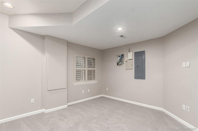 basement with electric panel, baseboards, carpet floors, and recessed lighting
