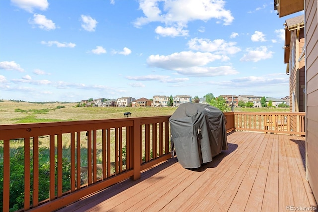 wooden deck featuring area for grilling