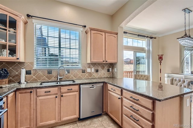 kitchen with light brown cabinetry, ornamental molding, sink, dishwasher, and hanging light fixtures