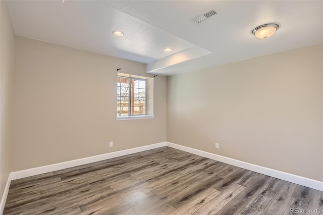 spare room featuring hardwood / wood-style flooring