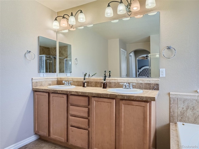 bathroom with vanity, tile patterned floors, and an enclosed shower