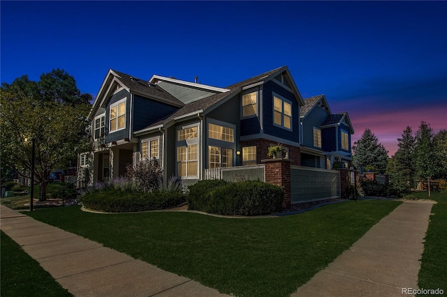 property exterior at dusk featuring a yard