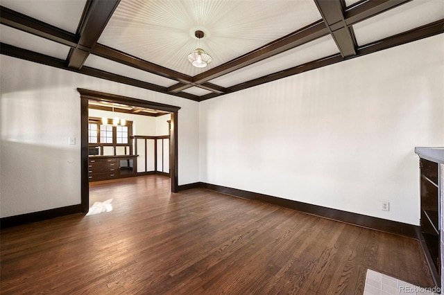 unfurnished room featuring dark hardwood / wood-style flooring, beamed ceiling, a notable chandelier, and coffered ceiling