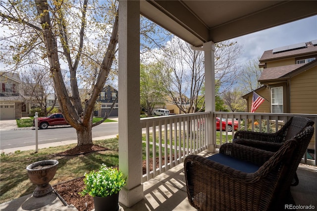 balcony featuring a porch and a residential view