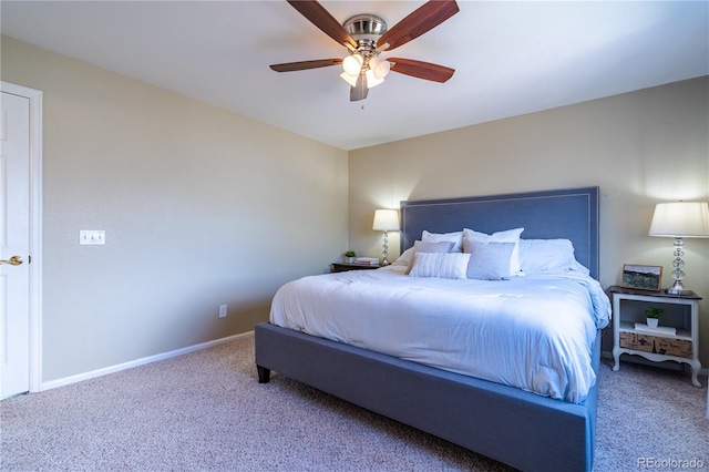 carpeted bedroom featuring ceiling fan and baseboards