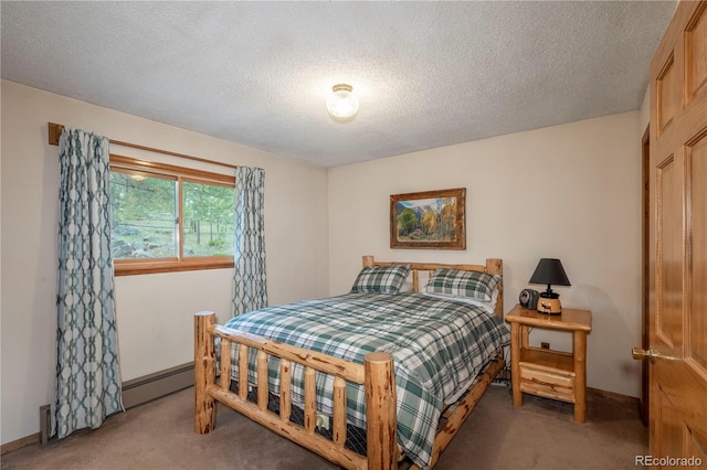 carpeted bedroom featuring a textured ceiling, baseboards, and a baseboard heating unit