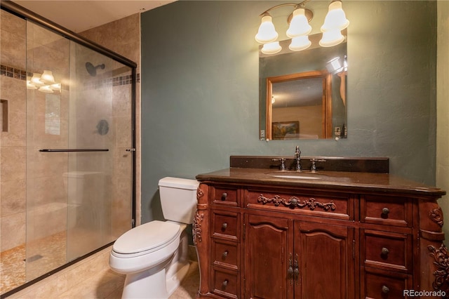 bathroom with a shower stall, toilet, and vanity