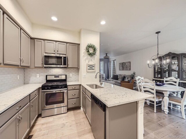 3921 E 141st Ave, Thornton, CO 80602 - kitchen with appliances with stainless steel finishes, gray cabinets, a sink, and recessed lighting