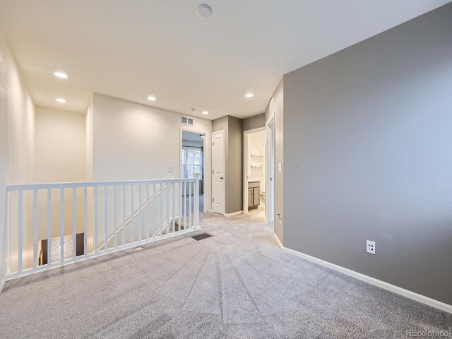 3921 E 141st Ave, Thornton, CO 80602 - unfurnished room with baseboards, light colored carpet, and recessed lighting