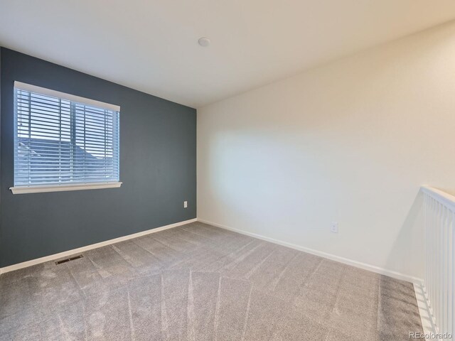 3921 E 141st Ave, Thornton, CO 80602 - spare room featuring carpet and baseboards