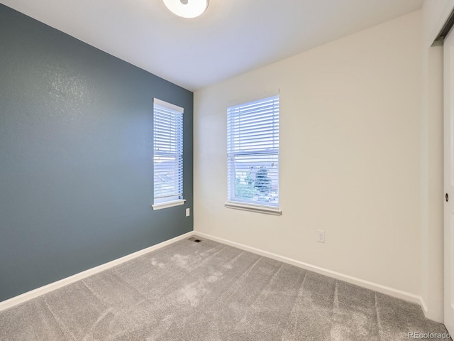 3921 E 141st Ave, Thornton, CO 80602 - carpeted empty room featuring healthy amount of natural light and baseboards