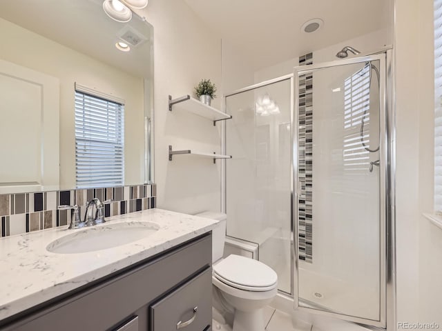3921 E 141st Ave, Thornton, CO 80602 - full bath with toilet, a stall shower, vanity, and tile patterned floors