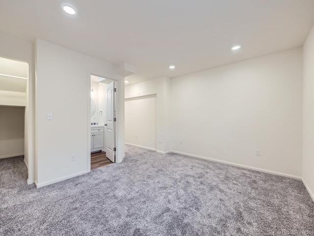 3921 E 141st Ave, Thornton, CO 80602 - unfurnished bedroom featuring carpet floors, baseboards, recessed lighting, and ensuite bathroom