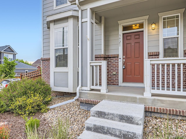 3921 E 141st Ave, Thornton, CO 80602 - entrance to property featuring brick siding and covered porch