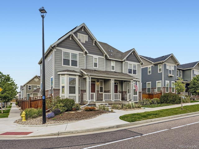 3921 E 141st Ave, Thornton, CO 80602 - townhome / multi-family property featuring a porch and brick siding