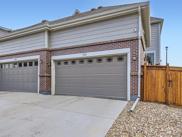 3921 E 141st Ave, Thornton, CO 80602 - garage featuring concrete driveway