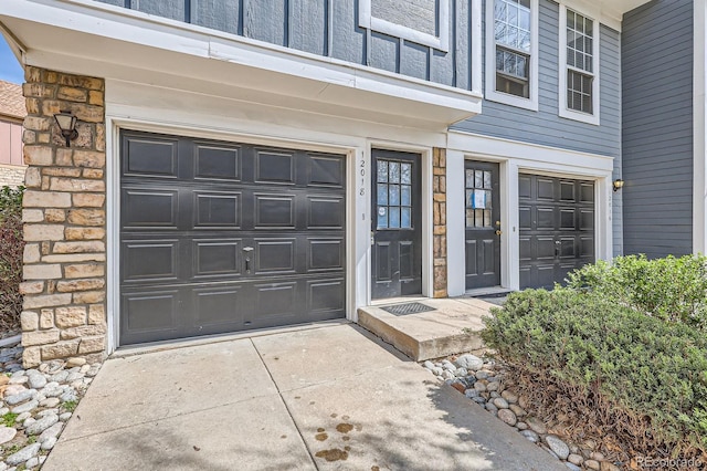 view of exterior entry featuring stone siding