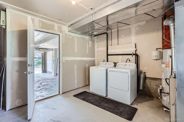 laundry area with washer and dryer, laundry area, visible vents, and gas water heater