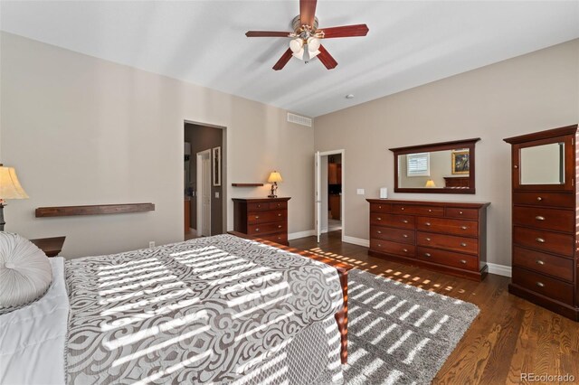 bedroom featuring wood finished floors, baseboards, and a ceiling fan