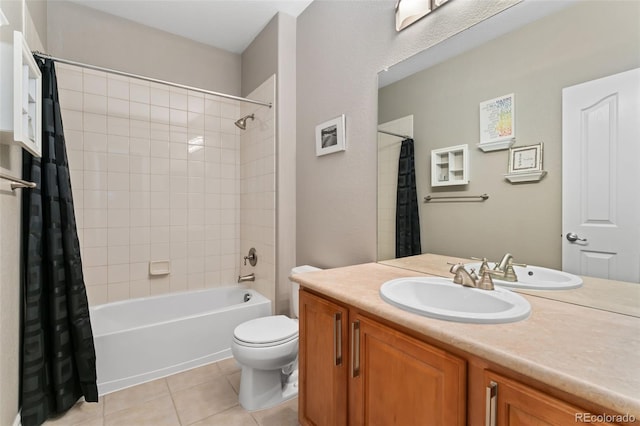full bath featuring tile patterned flooring, toilet, vanity, and shower / bath combo